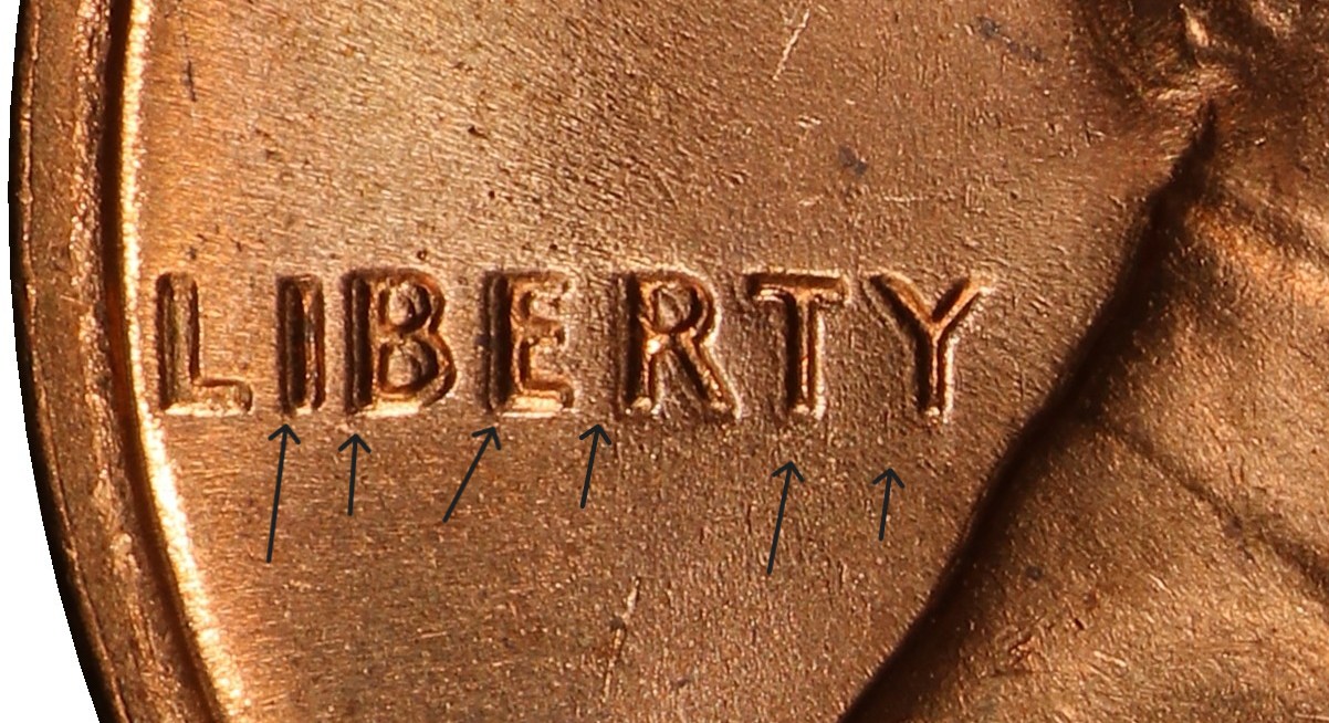 Machine-doubled LIBERTY on 1969-S cent showing flat shelf-like doubling