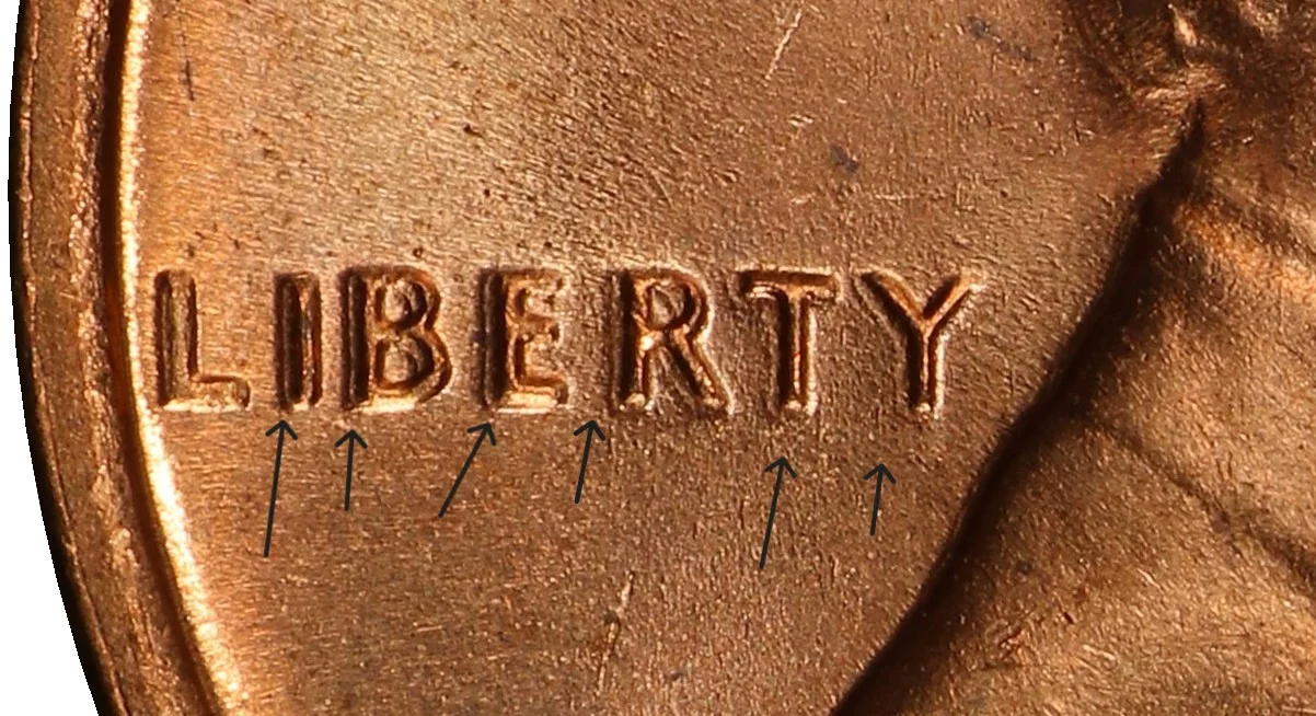 Machine-doubled LIBERTY on 1969-S cent showing flat shelf-like doubling