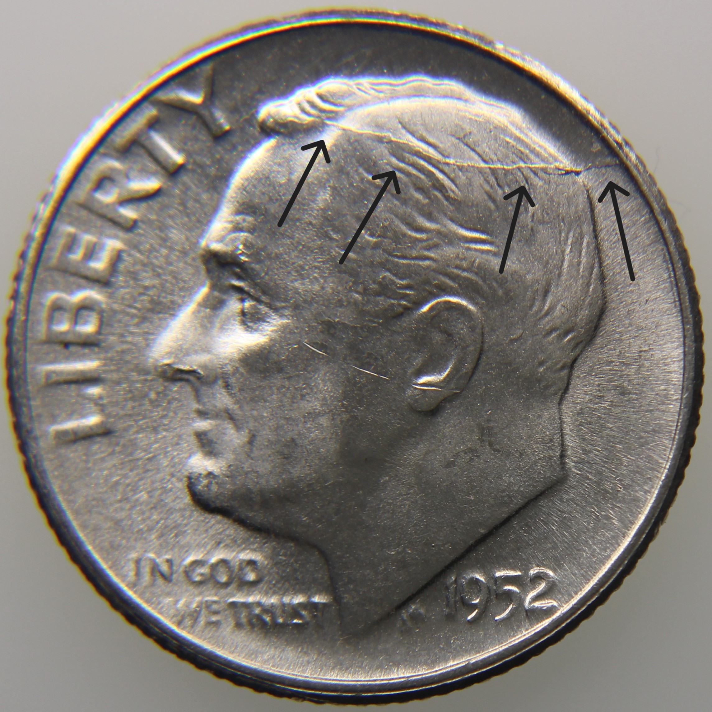 Die crack example showing raised line across design
