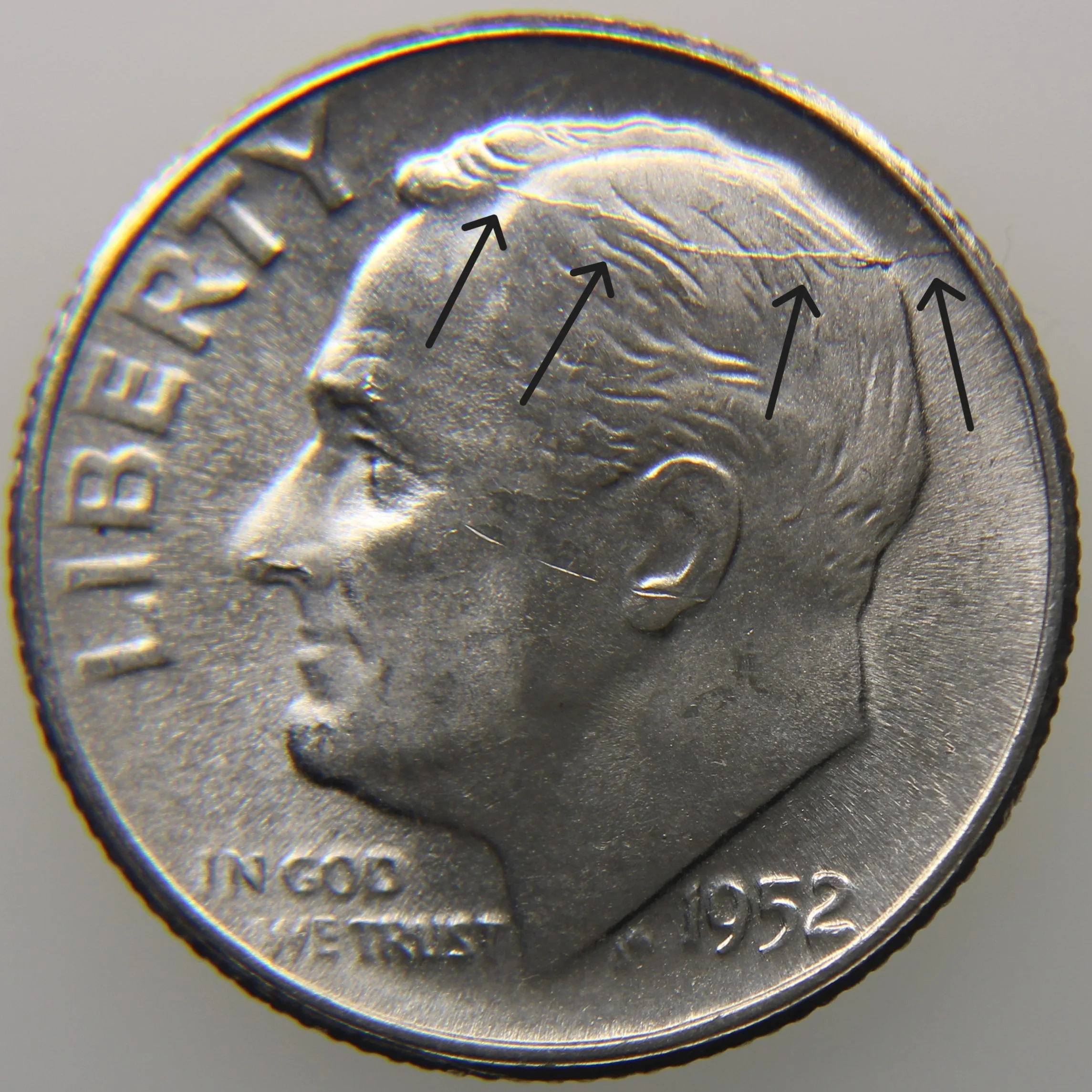 Die crack example showing raised line across design