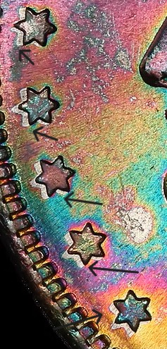 Pullaway effect near design elements — untoned areas where metal was stretched during striking