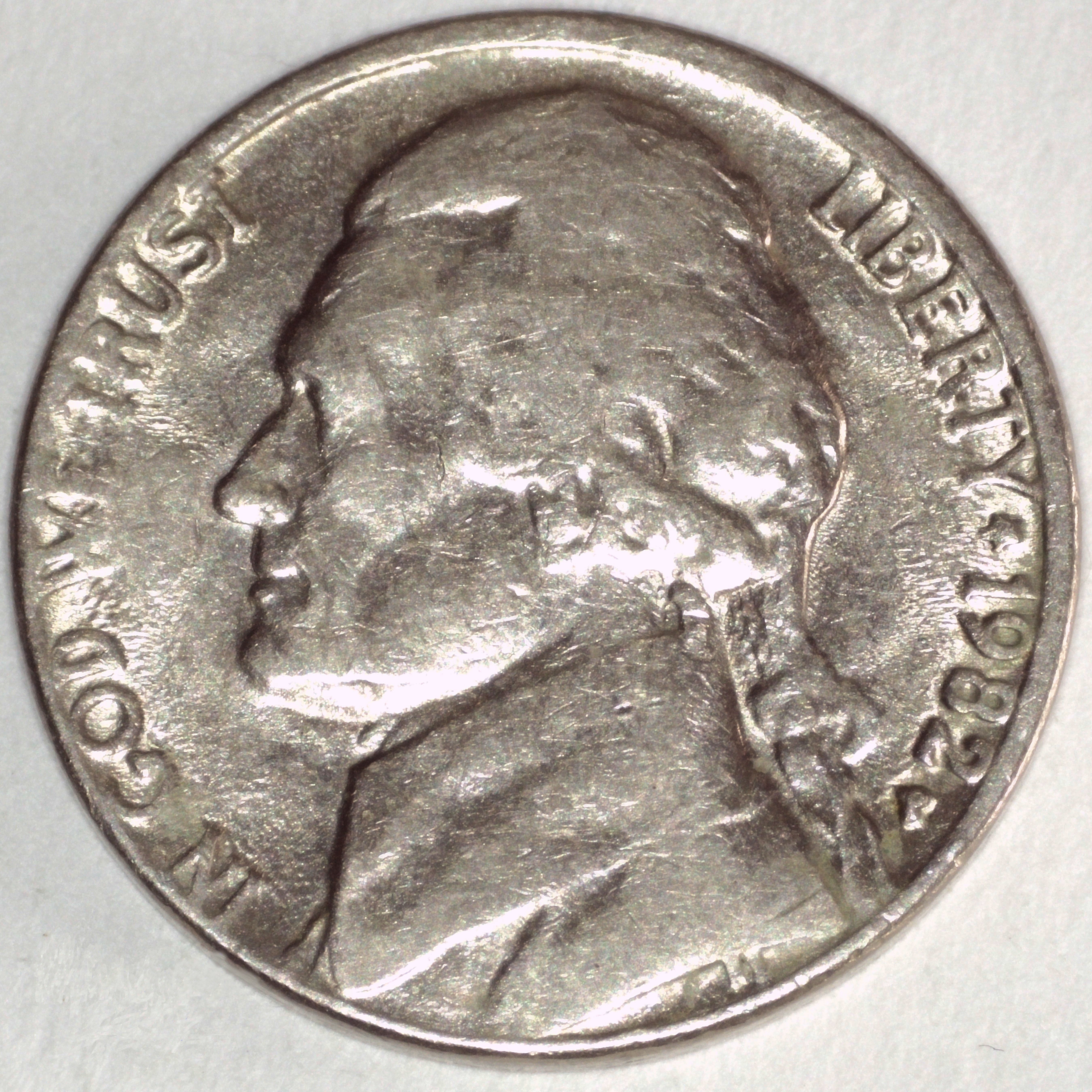 Die deterioration showing soft, blobby design elements