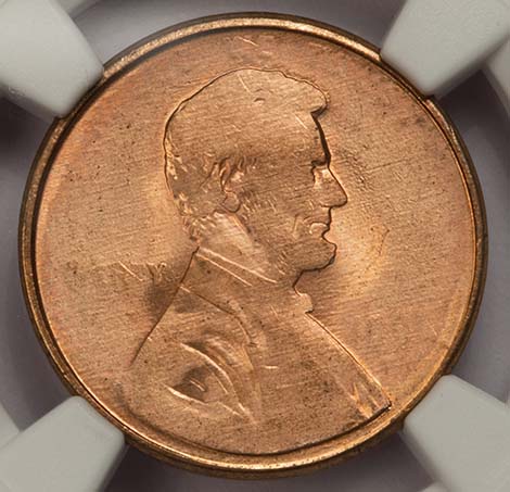 Grease-filled die error showing smooth, featureless areas