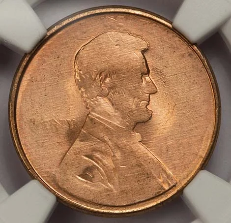 Grease-filled die error showing smooth, featureless areas