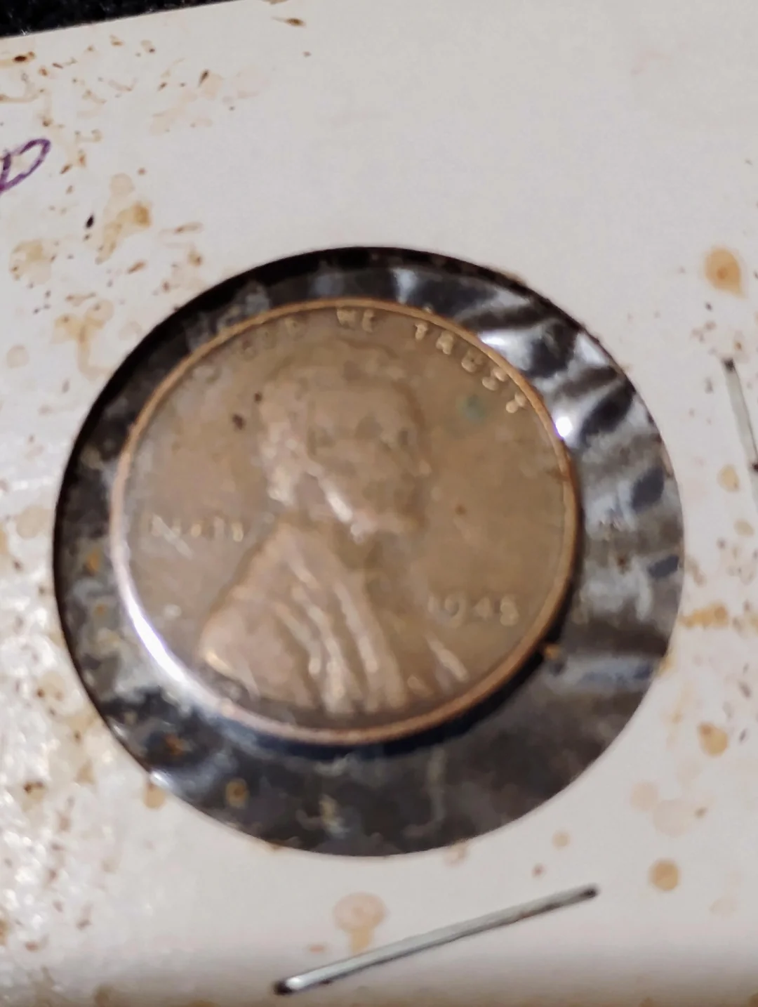 Poorly photographed coin — blurry and photographed through a flip/holder