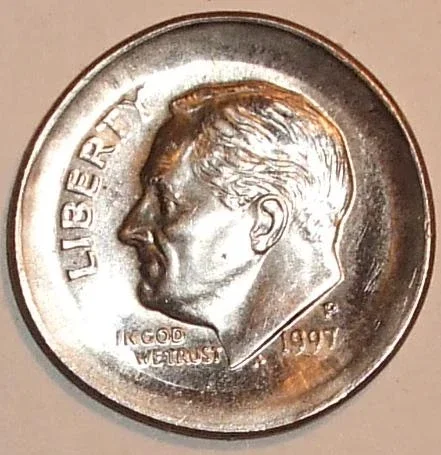 Broadstrike error coin showing full design struck without a collar