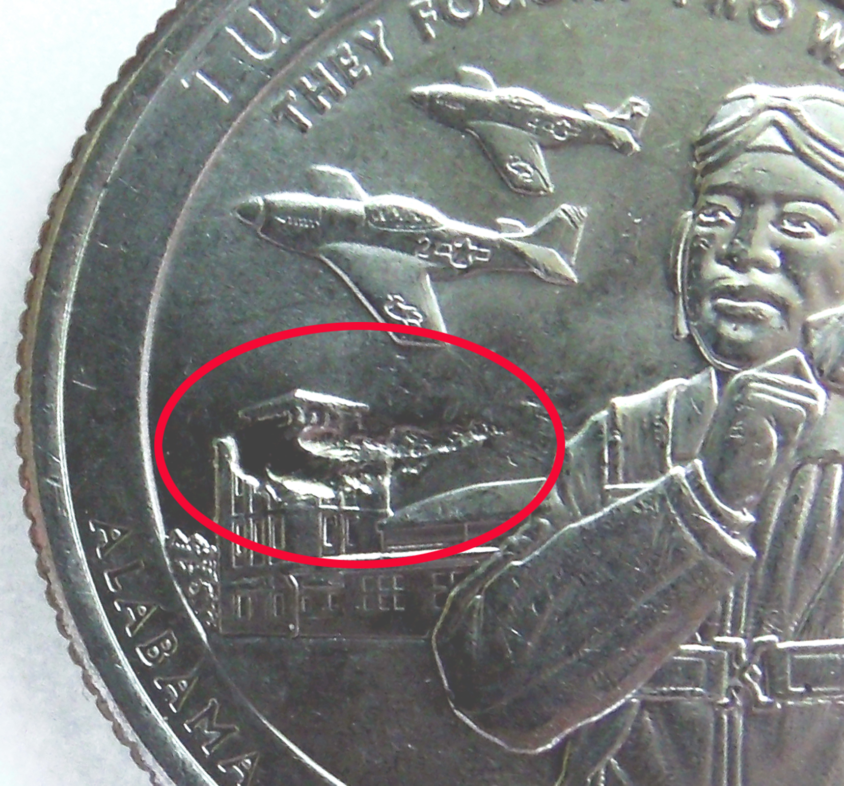 Close-up of the Burning Building strike-through showing the smoke-like appearance over the hangar