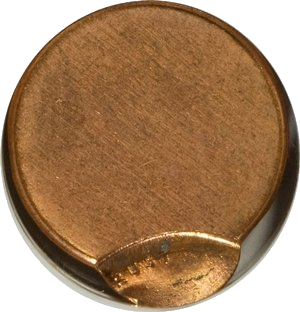 Lincoln Cent struck approximately 90% off-center — nearly the entire planchet is blank with only a tiny sliver of design visible