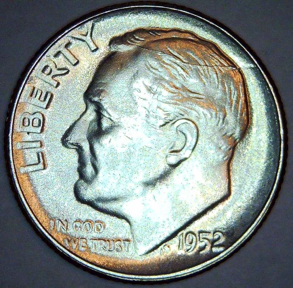 1952 Roosevelt dime, obverse — a raised die crack rises from the top of Roosevelt's head to the rim near 1 o'clock, forming a spike